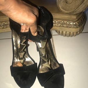 Black heels with gold accents